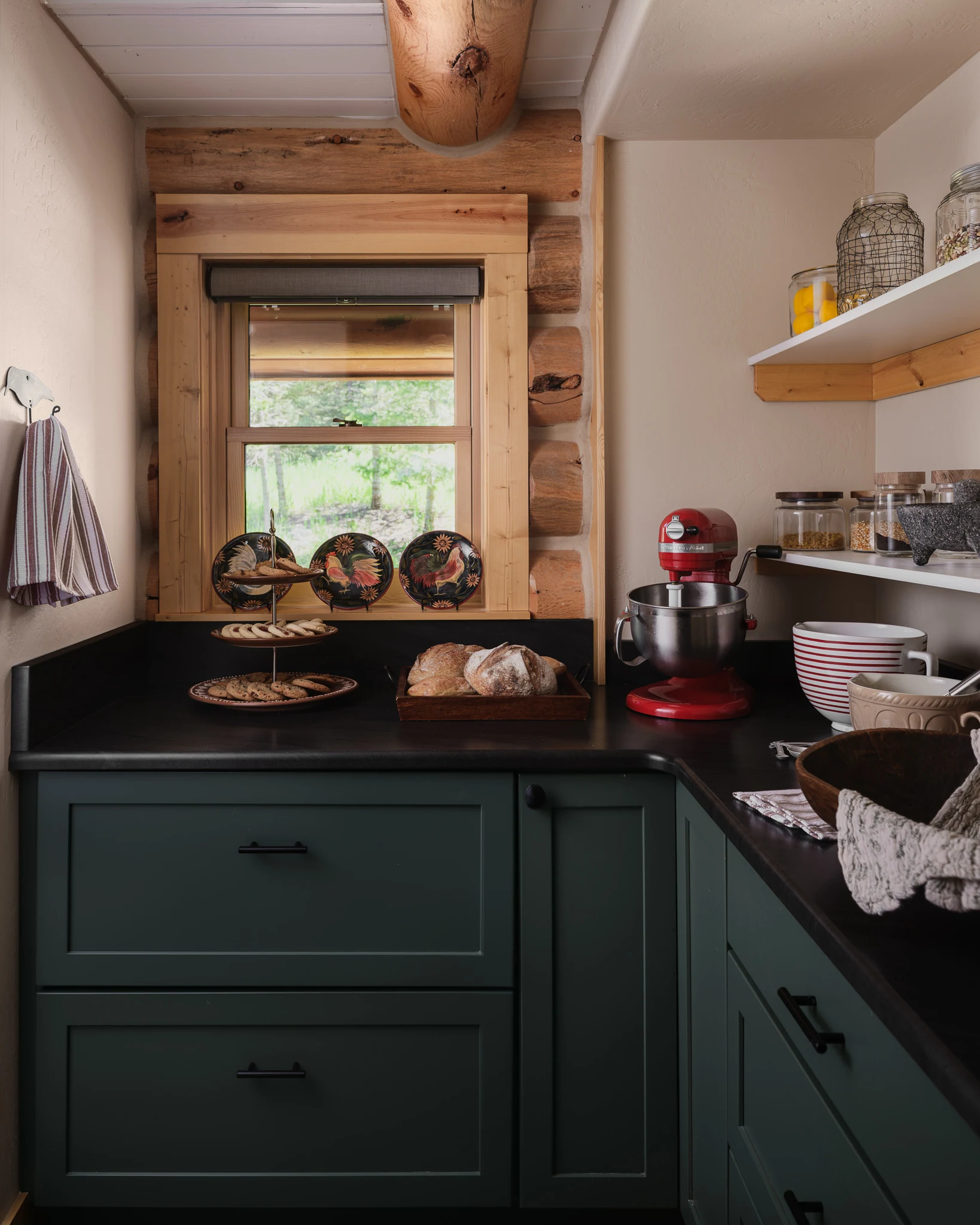 Pantry nook with dark green cabinetry and baking supplies — interior design photography Livingston Montana, Bear Canyon Ranch